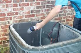 https://www.conwayservices.net/media/mtodk3fs/cleaning-ac-unit.jpg